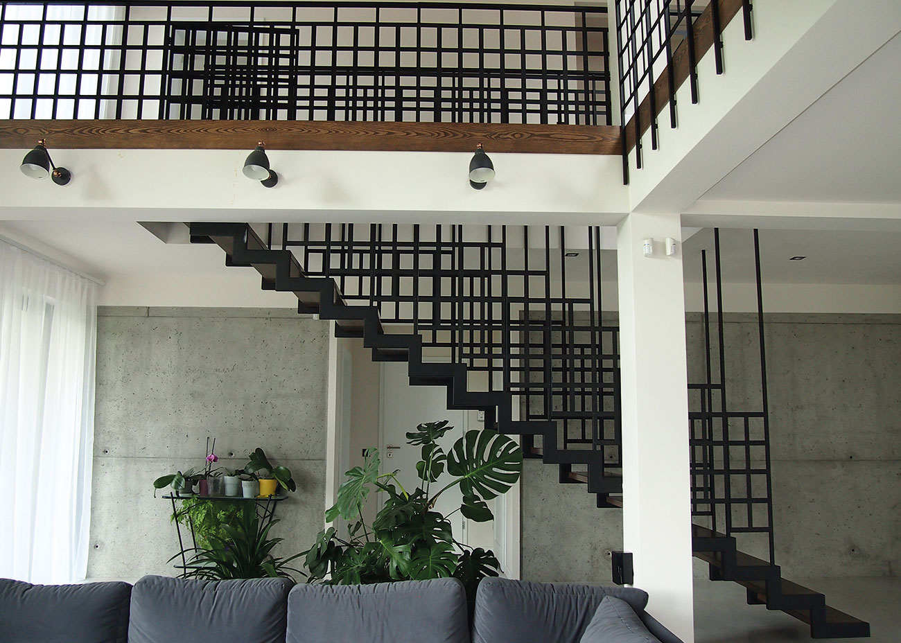 Black metal stairs construction with railing